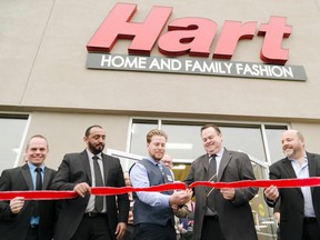 Goderich mayor Kevin Morrison, second from the right, helps the store manager David Mackechnie cut the ribbon during the grand opening ceremony for Hart Stores' new Goderich location. Pictured from left, Gerry Van Hurt, North Bay store manager; Samir Chougui, Maniwaki, Quebec, store manager; and John Pinkerton, far left, western regional sales and operational manager. (Darryl Coote/The Goderich Signal Star)