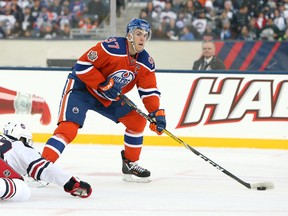 Connor McDavid of the Edmonton Oilers beats Toby Enstrom to feed Darnell Nurse for a goal against the Jets during the Heritage Classic two months ago. McDavid and the Oilers return to Winnipeg for a game with the Jets, this time at MTS Centre, on Thursday. (Jason Halstead/Getty Images file photo)