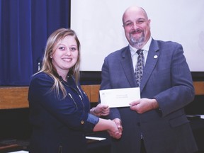 County Central High School Jordyn Cornet shakes hands with Palliser School Division chairman Robert Strauss and received the Rodeo Club Scholarship during the school’s awards night held at the Cultural-Recreational Centre Nov. 15. Jasmine O'Halloran Vulcan Advocate