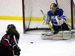 Great Lakes Wolfpack goalie Emma McCormick eyes a loose puck in her crease with Madison Winegard of the Northern Vikings nearby during a Lambton Kent senior girls’ high school hockey game at Sarnia Arena on Wednesday, Nov. 30, 2016 in Sarnia, Ont. Northern won 3-1. (Terry Bridge/Sarnia Observer)