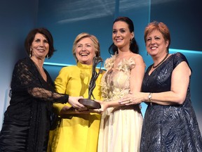 Pamela Fiori, from left, Hillary Clinton, Katy Perry, and Caryl Stern on stage during the 12th annual UNICEF Snowflake Ball at Cipriani Wall Street on November 29, 2016 in New York City. (Jason Kempin/Getty Images for UNICEF)