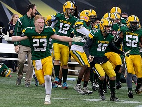 The Etobicoke Rams celebrate winning the Northern Bowl over the Superior Heights Steelhawks in Hamilton. (Veronica Henri/Toronto Sun)