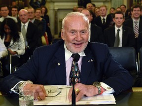 In this Tuesday, Feb. 24, 2015, file photo, Buzz Aldrin, former NASA astronaut and Apollo 11 pilot, prepares to testify on Capitol Hill in Washington. Officials said Aldrin, one of the first men to walk on the moon, has been evacuated by plane from the South Pole for medical reasons. (AP Photo/Susan Walsh, File)