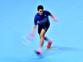 Milos Raonic of Canada plays a forehand shot during his men's singles semi final against Andy Murray of Great Britain on Day 7 of the ATP World Tour Finals at O2 Arena on Nov. 19, 2016 in London. (Justin Setterfield/Getty Images)