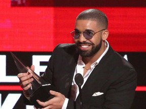 In this Nov. 20, 2016 file photo, Drake accepts the award for favorite album rap/hip-hop for "Views" at the American Music Awards in Los Angeles.  (Photo by Matt Sayles/Invision/AP, File)