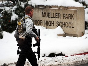 Officials respond to Mueller Park Junior High after a student fired a gun into the ceiling in Bountiful, Utah on Thursday, Dec. 1, 2016. (Ravell Call/The Deseret News via AP)