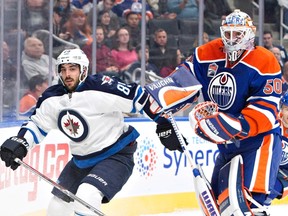 Mathieu Perreault returns to the Jets lineup on Thursday night. (THE CANADIAN PRESS/Jason Franson file photo)