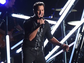 Luke Bryan performs "Move" at the 50th annual CMA Awards at the Bridgestone Arena on Wednesday, Nov. 2, 2016, in Nashville, Tenn. (Photo by Charles Sykes/Invision/AP)