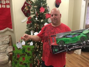 BRUCE BELL/THE INTELLIGENCER
Scott Whitelock, a long-time volunteer with the Christmas Angel Campaign in Prince Edward County, is pictured at the Kin Hall headquarters with some of the toys donated for local youngsters. Organizers are expecting the number of children registered with the program to take a big hike this year.