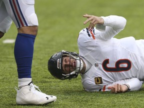 Chicago Bears quarterback Jay Cutler (6) reacts after getting knocked down by the New York Giants during the first quarter of an NFL football game in East Rutherford, N.J. Cutler will have season-ending surgery on his right shoulder. Coach John Fox announced Thursday, Dec. 1, that the veteran quarterback will have an operation to repair the labrum in his shoulder. (AP Photo/Seth Wenig, File)