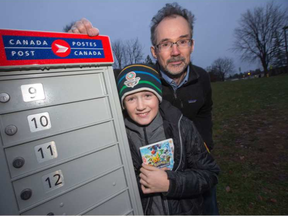 Kevin Boyce and his son, Finlay, 12, have been locked out of their Canada Post mailbox for more than a month. Canada Post changed the locks and put the new keys inside. (Wayne Cuddington)