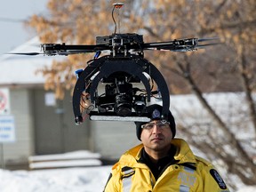 Const. Binoy Prabhu with the Major Collision Investigation Unit demonstrates the Edmonton Police Force's UAV (unmanned aerial vehicle) in this 2015 file photo. David Bloom/Edmonton Sun/Postmedia Network