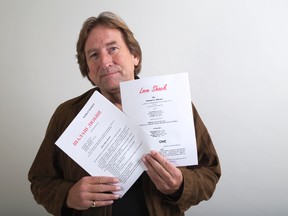 London playwright Mike Wilmot with Russian and English scripts of his work Love Shack. (DEREK RUTTAN, The London Free Press)