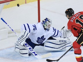 Flames’ Matt Stajan scores on Maple Leafs goaltender Jhonas Enroth during the first period on Wednesday in Calgary. Enroth, the team’s backup, is 0-3-1 with an .872 save percentage. (GAVIN YOUNG/POSTMEDIA NETWORK)