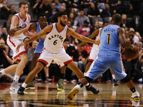Raptors' Cory Joseph (6) guards Nuggets' Jameer Nelson (1) during first half NBA action in Toronto on Oct. 31, 2016. (Jack Boland/Toronto Sun)