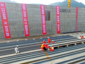 The keel of Titanic's replica is laid by working staff in a project on November 30, 2016 in Suining, Sichuan Province of China. The Sinking of Titanic Keel Laying Project started in Suining to construct a Titanic's replica and the replica will serve as a cruise boat for visitors around the World to visit and experience after its completion. Camera crew of the United States National Geographic will take pictures and record the entire event of the project. (Photo by VCG/Getty Images)