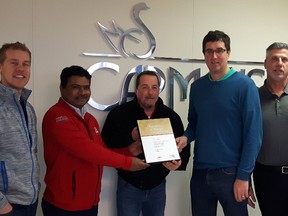 Adam Dewit, Haresh Patel, Jim Young, Mike Harman and Christopher Martin pose for a photo where Hydro One is presenting the Beachville Carmeuse Lime facility with the Excellence in Energy Conservation award on Thursday. (Submitted Photo)