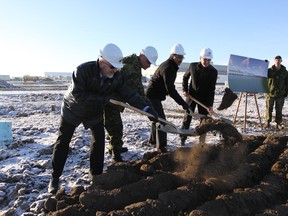 (From left) Steven Karpyshin, regional director of Western Canada for Defence Construction Canada; Michael Kazda, vice president of Ellis Don; Lt. Col. Corey Frederickson; and MP for Edmonton-Mill Woods Amarjeet Sohi were on hand to turn the sod and officially begin construction of a new Tactical Armoured Patrol Vehicle facility at the Edmonton Garrison Dec. 2, 2016.