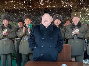 This undated picture released from North Korea's official Korean Central News Agency (KCNA) on December 2, 2016 shows North Korean leader Kim Jong-Un (C) attending an intensive drill of KPA artillery units on the front. (KCNA/AFP/Getty Images)