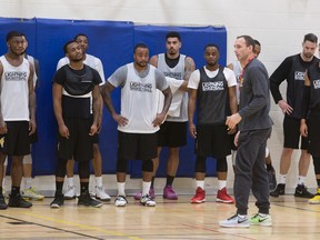 Head coach Kyle Julius talks his players through a drill on the opening day of London Lightning training camp at the Central Y on Friday. (CRAIG GLOVER, The London Free Press)