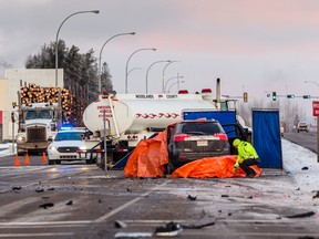 Whitecourt RCMP investigate a fatal collision which happened at about 6 a.m. Dec. 2, 2016 at the intersection of Highway 43 and Dahl Drive involving a Town of Whitecourt fire rescue tanker and an SUV.  	Hannah Lawson/Postmedia