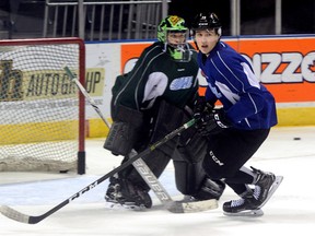 London Knights Janne Kuokkanen cuts in front of goaltender Tyler Parsons during practice at Budweiser Gardens on Thursday Dec 1, 2016 (MORRIS LAMONT, The London Free Press)