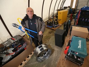 Jeff Noiseux, of Associated Auto Auction, displays some items that will soon be up for auction. This Sunday, 263 items will be sold in an unreserved auction. The police auction includes jewelry, tools, and more. Funds raised go to The City of Winnipeg. Tuesday, November 29, 2016. (Winnipeg Sun/Postmedia Network)