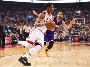 Raptors guard DeMar DeRozan (10) drives past Lakers guard Jose Calderon (5) during first half NBA action in Toronto on Friday, Dec. 2, 2016. (Frank Gunn/The Canadian Press)