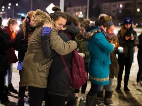Family and friends of Mariama Sillah hold a vigil for her on Friday, December 2, 2016 at the location where she was killed by an ETS bus on November,26 in Edmonton.  Greg Southam / Postmedia