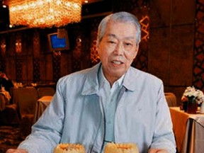 In this 2008 photo, chef Peng Chang-kuei poses for a photo as he is seated at a table in his restaurant Peng's Garden in Taipei, Tawain. (Chiang-Zhong Su/United Daily News/World Journal via AP)
