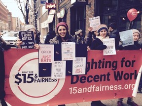 About 30 UberEATS employees protested the company's Toronto headquarters on Adelaide St. W. on Dec. 3, 2016 because they are angry they payments they receive have been cut. (Kevin Connor/Toronto Sun)
