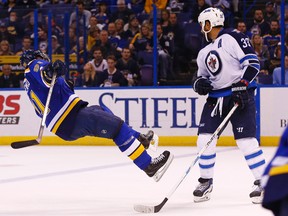 Dustin Byfuglien shows the Blues' Vladimir Tarasenko who's boss. (BILLY HURST/AP)