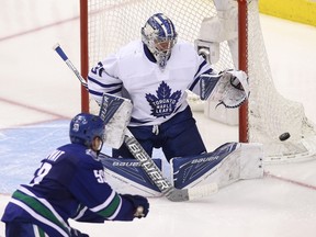 Maple Leafs goaltender Frederik Andersen makes a save on Bo Horvat of the Canucks last night in Vancouver. (BEN NEIMS/THE CANADIAN PRESS)