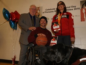 Jason Miller/The Intelligencer
Mayor Jim Harrison joins in on a photo with guest speakers Phil Kerr and Canadian Paralympian rower, Victoria Nolan during the International Day of Persons with Disabilities event at the Quinte West YMCA Saturday.