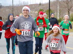St. David School Vice Principal, Colin Laplame and grade 5 student, Katelynn Michauville run the Santa Shuffle.The students and staff of St. David Catholic School once again participated in the Salvation Army's Santa Shuffle and Elf Run.  The students and school staff raised funds to support the run.  The event assists the Salvation Army support families in need during the Christmas season and throughout the year.  All pledges raised for the Santa Shuffle and Elf Run help people in our community who struggle to make ends meet.  St. David School raised $634.65 for the Salvation Army.
