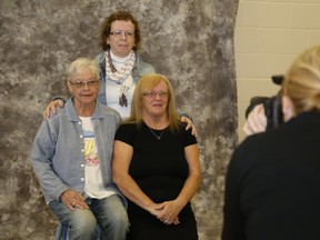 Jason Miller/The Intelligencer
Linda Murray (front left), Barb Sagriff and Donna Martin have their first portrait done together as sisters during the Help Portrait sessions Saturday in Belleville.