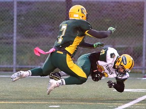 Lockerby Vikings David Pushman gets taken down by Curtis Theobald of the Confederation Chargers during senior boys high school football action in Sudbury, Ont. on Tuesday October 25, 2016. Theobald was named the Ricker Defensive Player of the Year last week by the SDSSAA. Gino Donato/Sudbury Star/Postmedia Network