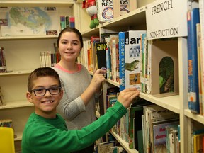 R.L. Beattie Public School students Max Arnold, front, and Amanda Bourdon spend time in the school library on Thursday. (John Lappa/Sudbury Star)
