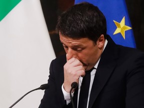 Italian Premier Matteo Renzi speaks during a press conference at the premier's office Chigi Palace in Rome, early Monday, Dec. 5, 2016. Renzi acknowledged defeat in a constitutional referendum and announced he will resign on Monday. Italians voted Sunday in a referendum on constitutional reforms that Premier Matteo Renzi has staked his political future on. (AP Photo/Gregorio Borgia)