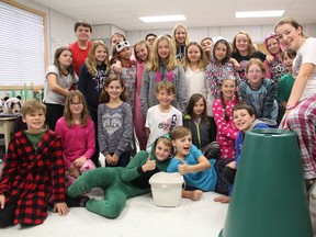 A Grade 5/6 class at Roch Carrier French Immersion Public School recently won a composting contest run by the Oxford Coalition for Social Justice. They will use their green cone in the school's composting program, which the students facilitate by collecting green bin materials from each classroom and even washing out the bins each week. (The students shown here were dressed for pyjama day). (MEGAN STACEY/Sentinel-Review)