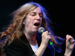 Patti Smith performs at the Ottawa Folk Festival at Hogs Back Park in Ottawa On, Wednesday Sept 4, 2013.( Tony Caldwell, Postmedia Network)