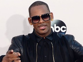 R Kelly arrives for the 2013 American Music Awards at the Nokia Theatre L.A. Live in downtown Los Angeles, California, November 24, 2013. (FREDERIC J. BROWN/AFP/Getty Images)
