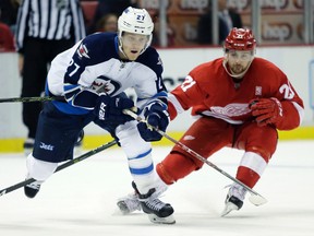 Nikolaj Ehlers is pursued down the ice by Detroit Red Wings left-winger Tomas Tatar during last month's game in Detroit, won 5-3 by the Jets. The teams meet again Tuesday at MTS Centre. (AP File Photo/Duane Burleson)