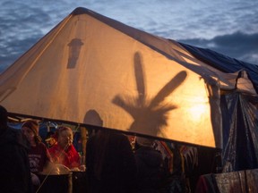 Philip Norton/Special To The intelligencer
A light throws a silhouette against a tent wall as "water protectors" protesting the Dakota Access oil pipeline settle in for the evening at one of three camps along the Missouri River in North Dakota.