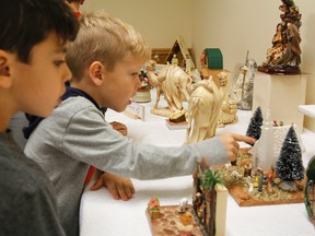 Elliott Carter a Grade 1 student from Our Lady of Mount Carmel Catholic School, takes a closer look through The Nativity Exhibition with his classmates at St. Paul The Apostle Roman Catholic Church in Kingston, Ont. on Thursday December 1, 2016. The annual event ran on Thursday and Friday last week. Julia McKay/The Whig-Standard/Postmedia Network