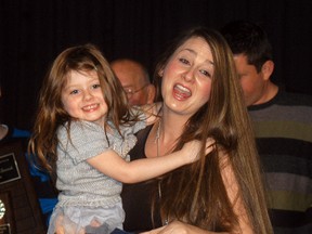 Meaghan Kehoe celebrates with her daughter MacKenna Kehoe during the finals of the Homeward Star Search competition held on Friday, Dec. 1 at the CBD Club.