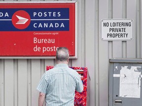 A union spokeswoman says members of the Canadian Union of Postal Workers have ratified the tentative agreement reached last summer with Canada Post. (THE CANADIAN PRESS/Darren Calabrese)