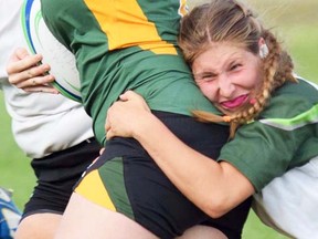 Bailey Meraw, shown making a tackle during the recent OCAA women's rugby season, is the 2016 Belleville Junior Bulldogs U18 girls MVP (backs) plus OCAA women's Rookie of the Year with the Ottawa Algonquin Thunder. (OCAA photo)