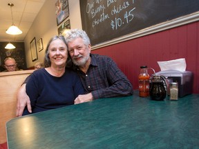 Bev and Paul Mills rekindle that old romantic feeling in a booth Monday at Campus Hi-Fi, the Richmond Row eatery where the married couple had their first date 50 years ago after meeting through a computer matching service offered to Western University students in 1966. (CRAIG GLOVER, The London Free Press)