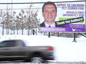 A billboard at the corner of Walford Road and Paris Street featuring the late Sam Bruno thanks Sudburians for their support of the PET fundraising efforts. In early November the fundraising for a PET scanner reached its goal after two anonymous donors stepped forward with $500,000 each. (Gino Donato/Sudbury Star)